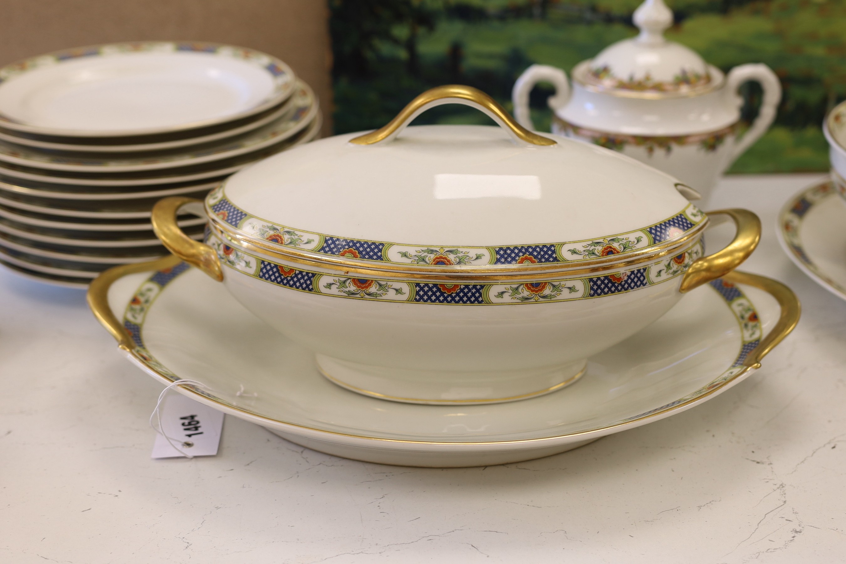 A Limoges gilt and floral decorated dinner service